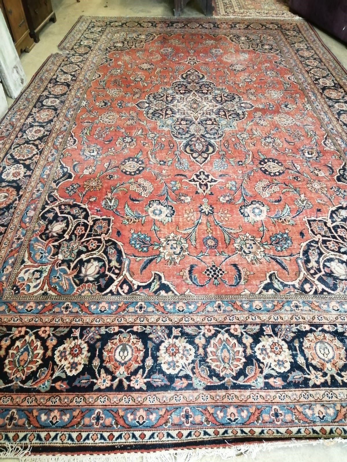 A Heriz brick red ground carpet, a.f., 540 x 360cm